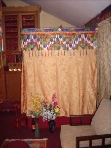 sand mandala inside the gold curtain