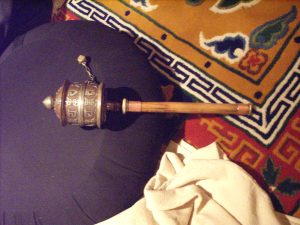 an older prayer wheel - how many revolutions have I traveled?