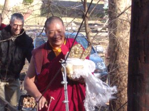 Drupon Thinley Ningpo holds the sand from mandala