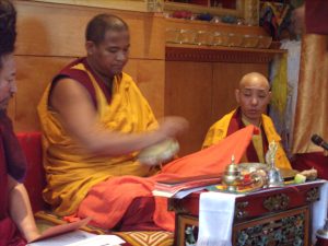 Khenpo Tsultrim starting to offer a mandala